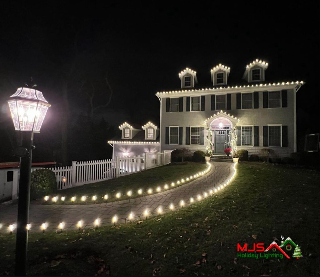 Festively lit colonial house at night